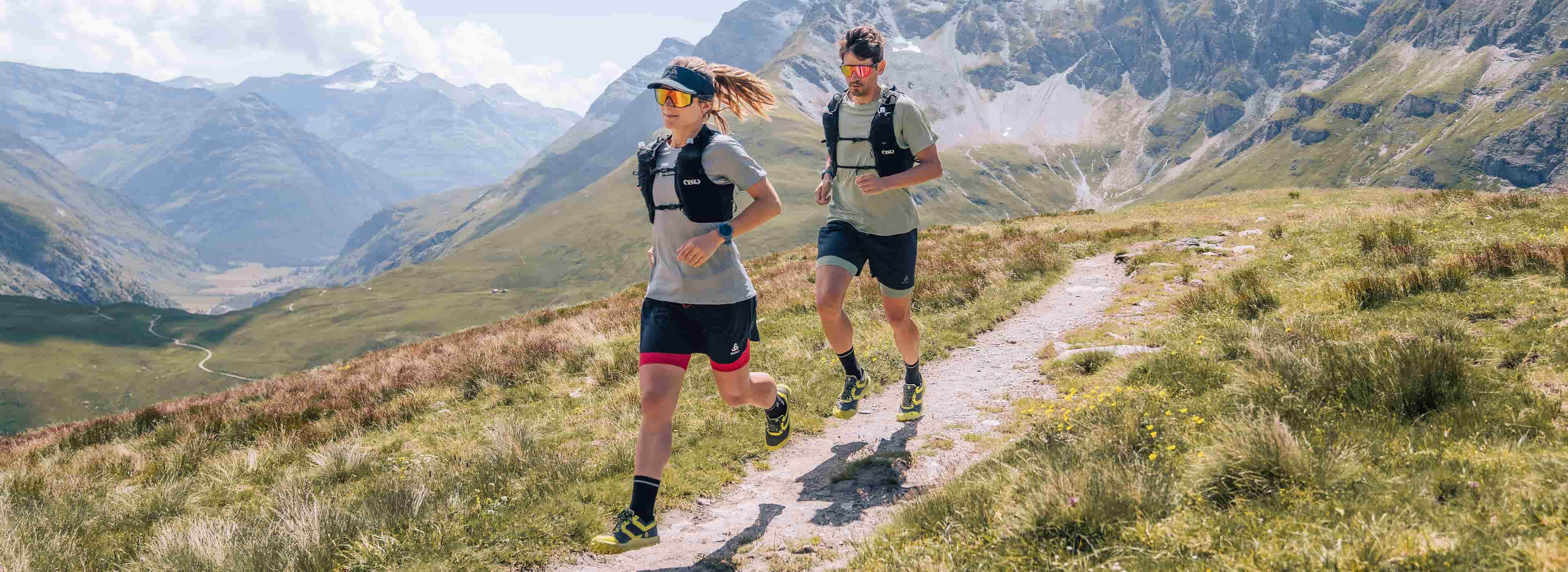 women and men running in x-alp trail running spring summer collection