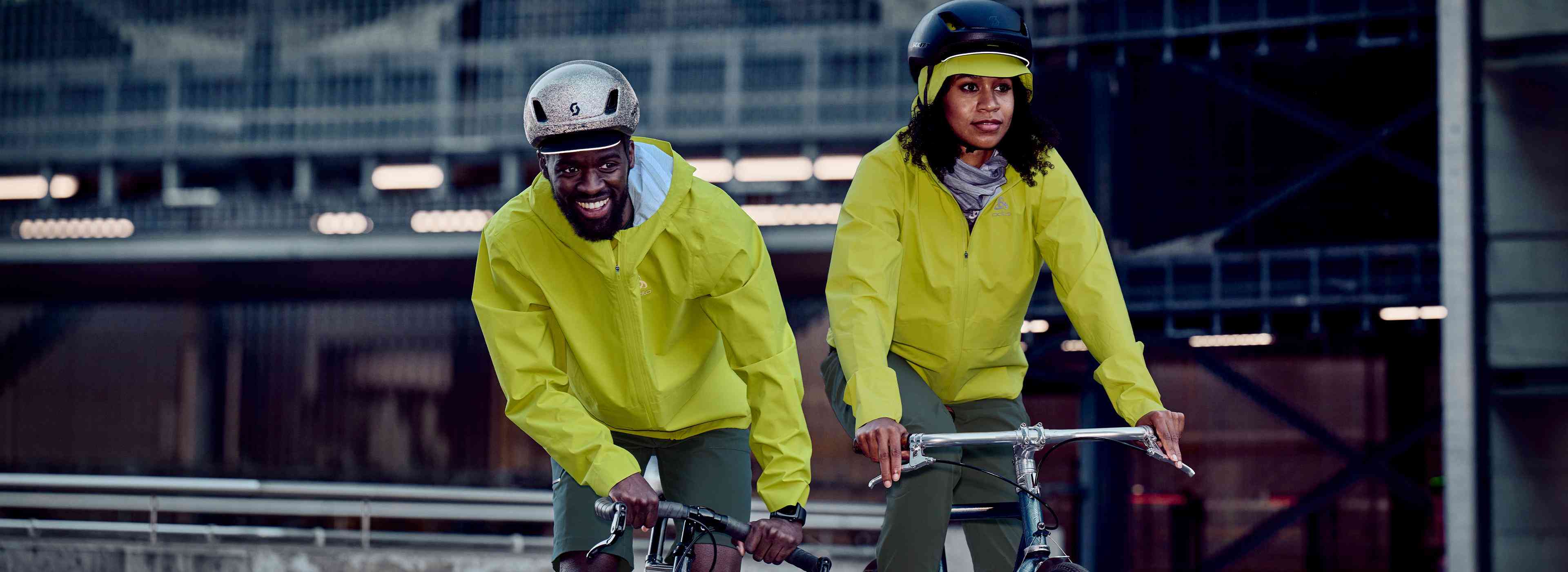 A couple of cyclists wearing waterproof jackets