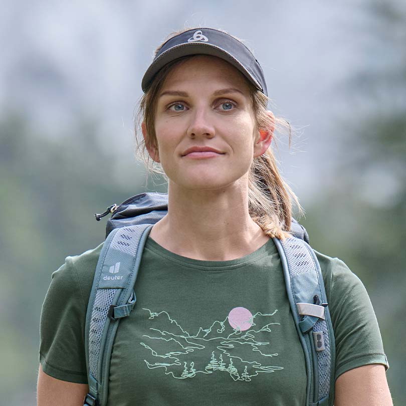A woman wearing a hiking t-shirt