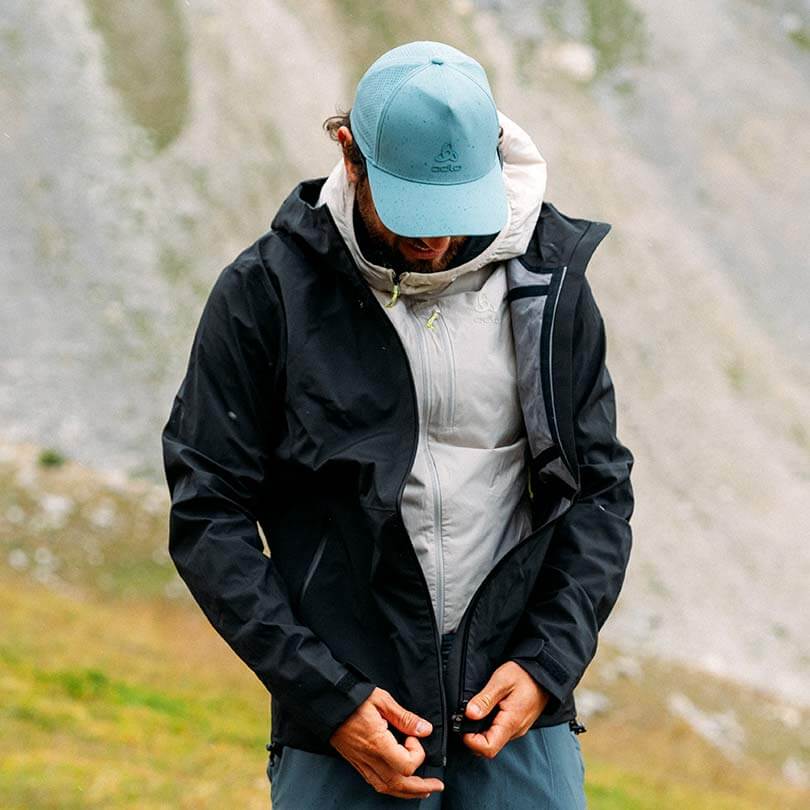 A man wearing a hiking jacket