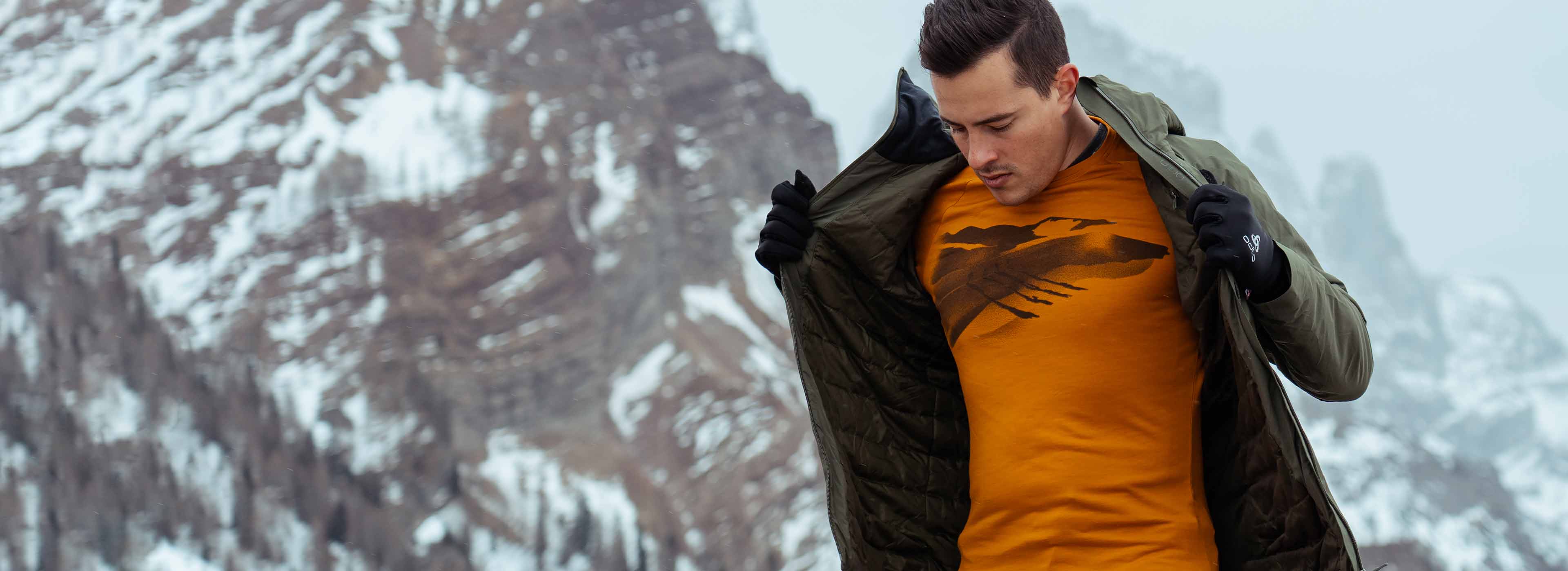 A man wearing light base layer outfit crafted with merino wool
