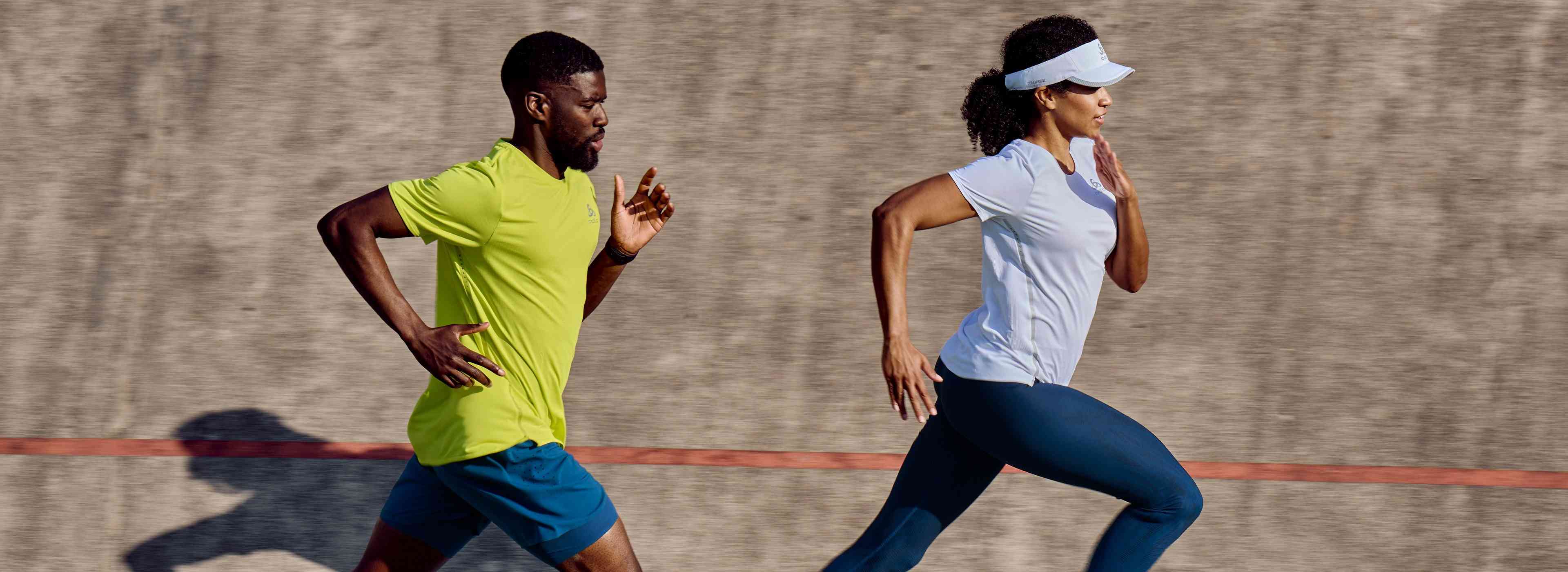 a man and a woman running, each wearing light summer running gear