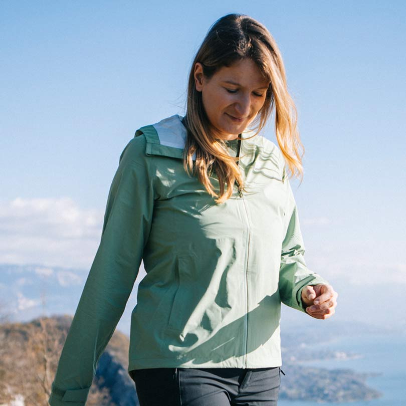 A woman wearing essential hiking clothing