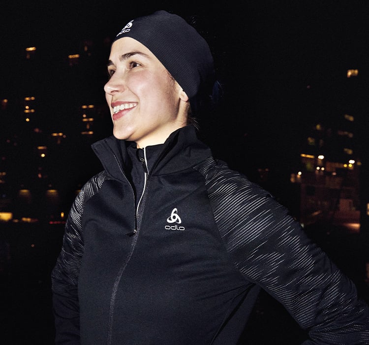 A woman with a winter running jersey