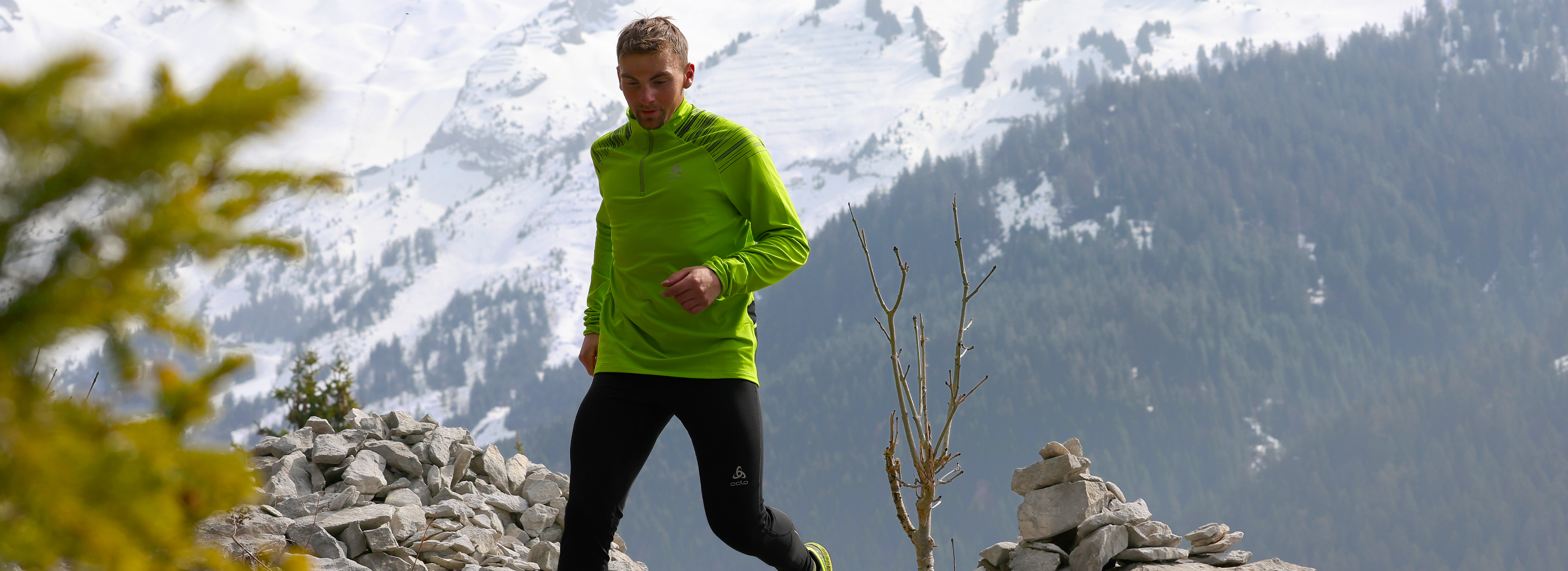 A male trail runner running in the Alps
