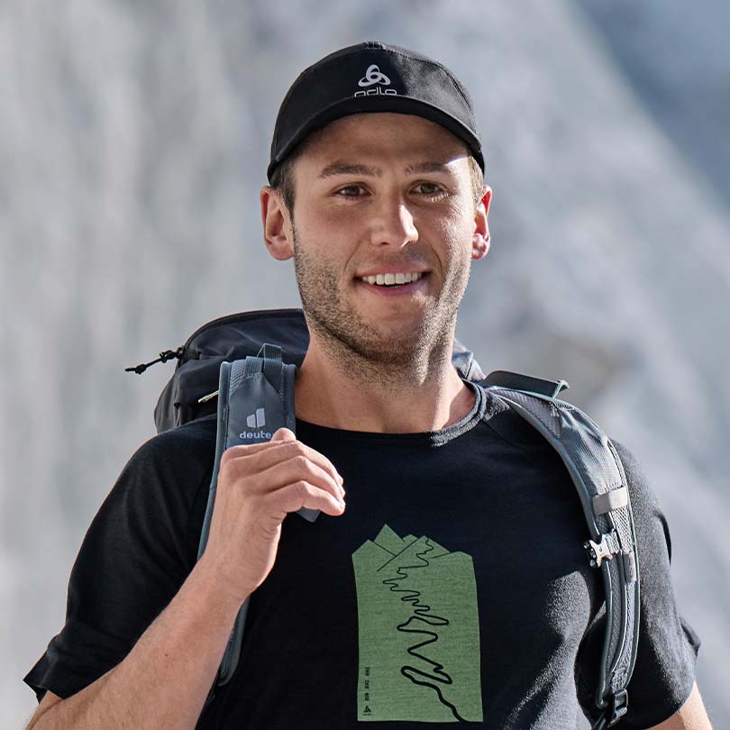 A man wearing a hiking t-shirt