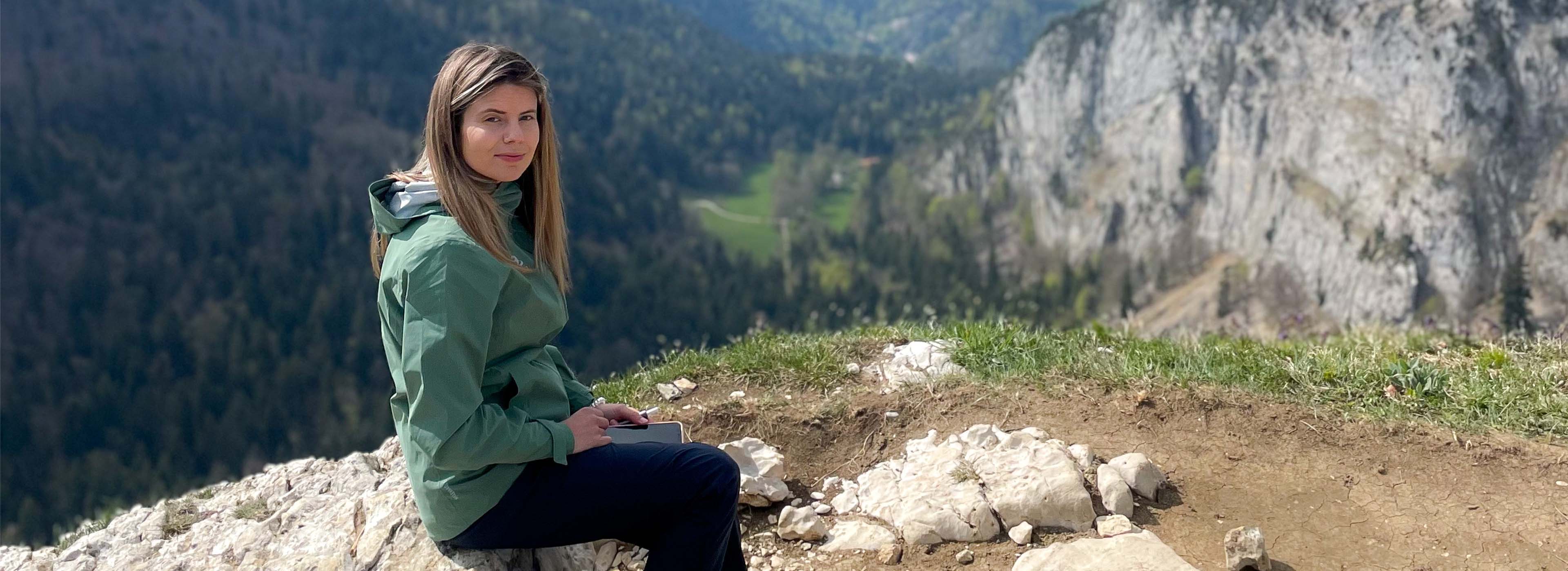 a woman wearing a hiking pant and a merino t-shirt