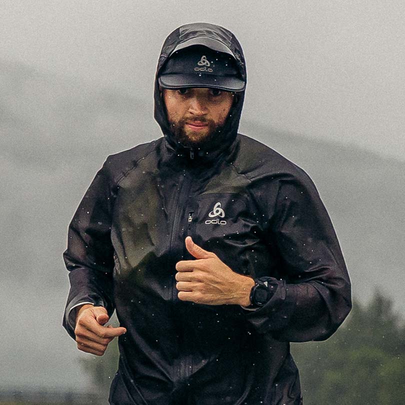 A man wearing a running jacket