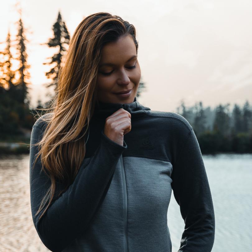 A woman wearing a hiking hoodie