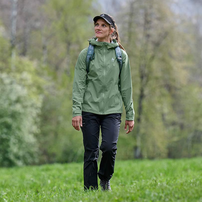 A woman wearing hiking gear