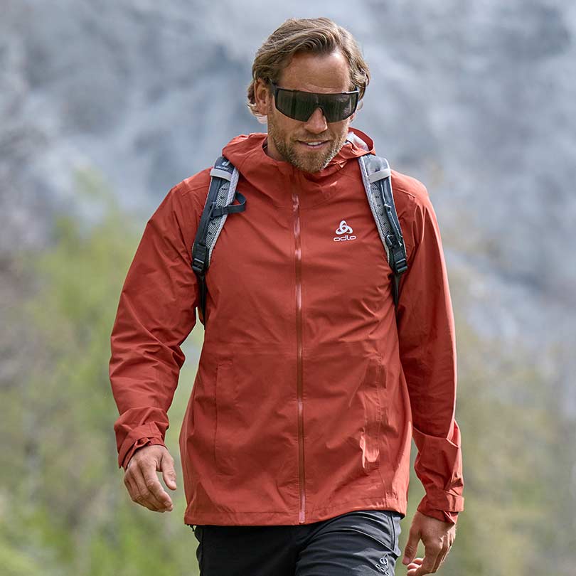 A man wearing essential hiking clothing