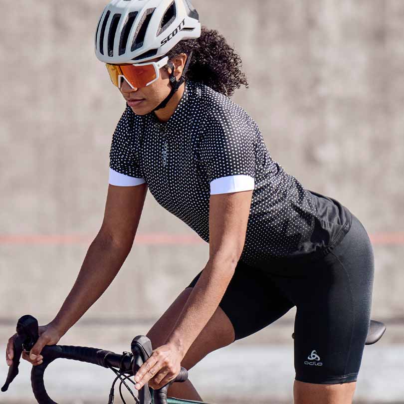 A woman cycling at moderate intensity 