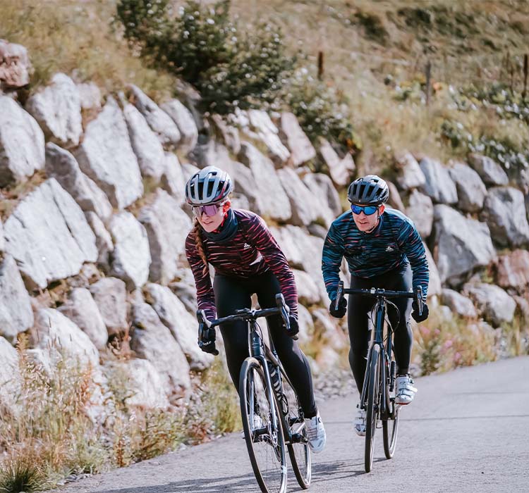 A man and woman in winter cycling gear