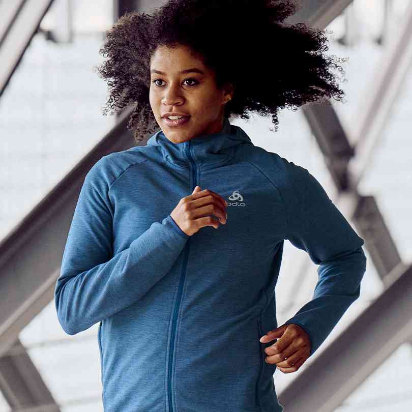 A woman wearing a running hoodie