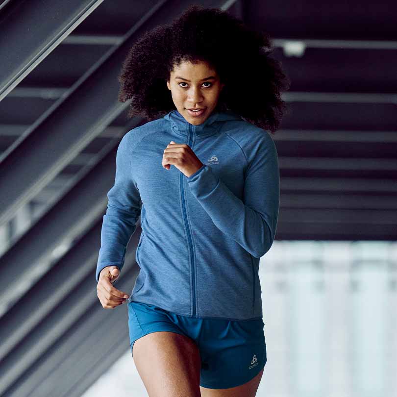 A woman who runs at moderate intensity 