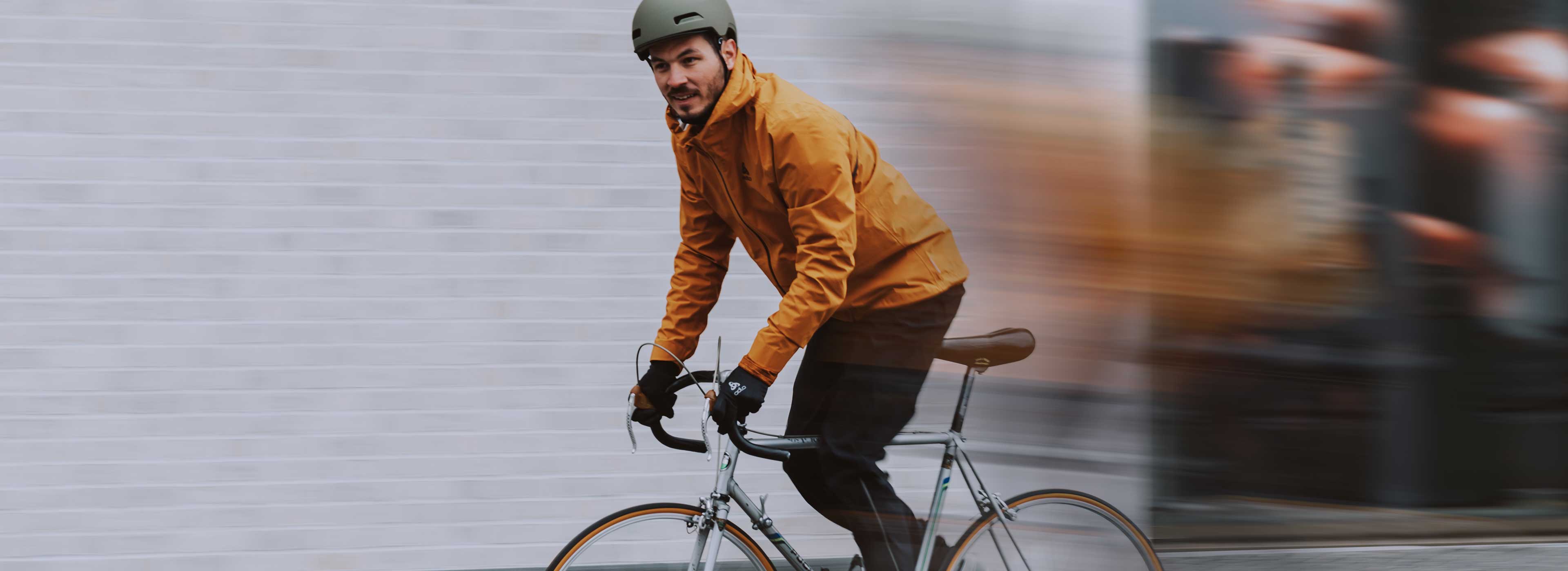 a man on a city bike, wearing a t-shirt designed for bike commuting