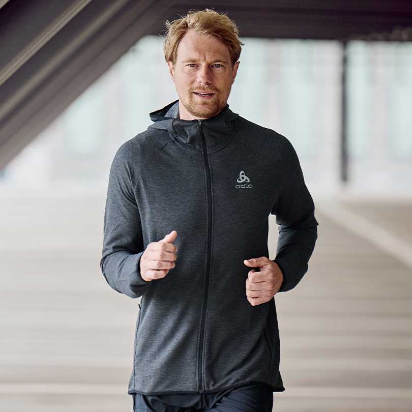 A man wearing a running hoodie
