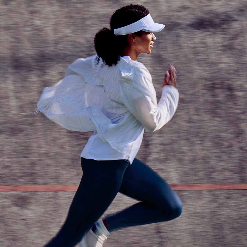 A woman running at high intensity